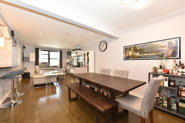 dining area featuring crown molding and dark hardwood / wood-style floors