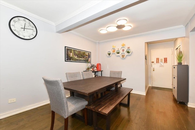 dining space featuring crown molding and dark hardwood / wood-style flooring