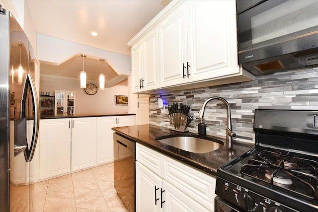 kitchen featuring pendant lighting, sink, black appliances, white cabinets, and decorative backsplash