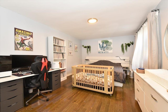 bedroom with dark wood-type flooring