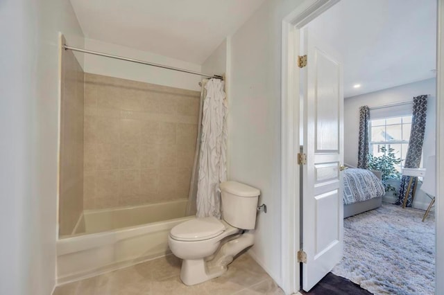 bathroom featuring shower / bathtub combination with curtain and toilet