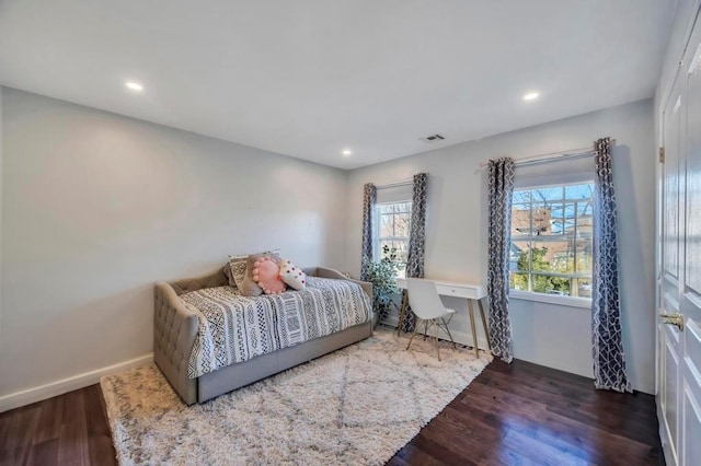 bedroom featuring dark wood-type flooring