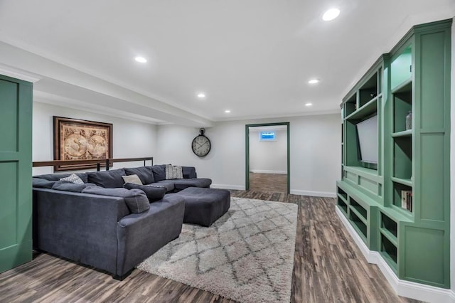 living room with ornamental molding and dark hardwood / wood-style floors