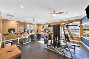 workout area with ceiling fan