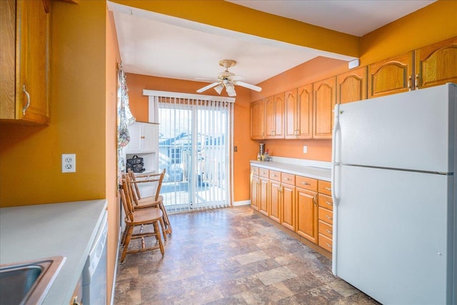 kitchen featuring sink, white appliances, and ceiling fan