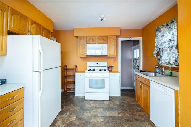 kitchen featuring sink and white appliances