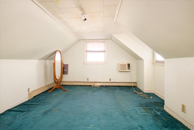 bonus room with dark carpet, a wall unit AC, and lofted ceiling