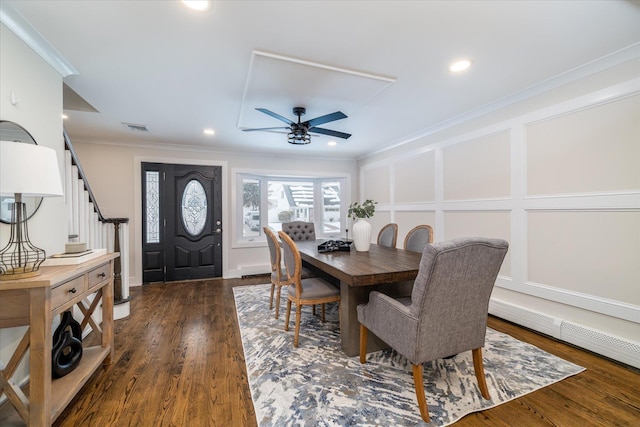 dining space featuring ceiling fan, dark hardwood / wood-style flooring, and crown molding