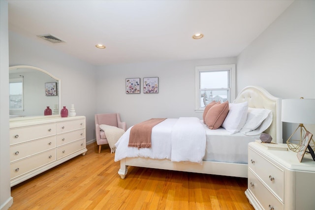 bedroom with light hardwood / wood-style floors