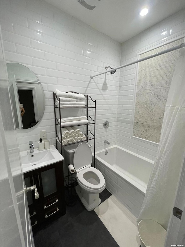 full bathroom featuring toilet, vanity, and shower / tub combo with curtain