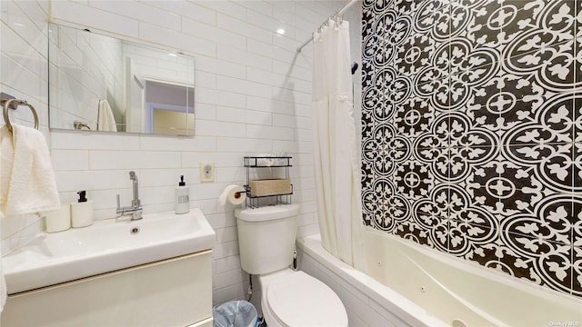 full bathroom featuring shower / bath combo, toilet, tile walls, and vanity