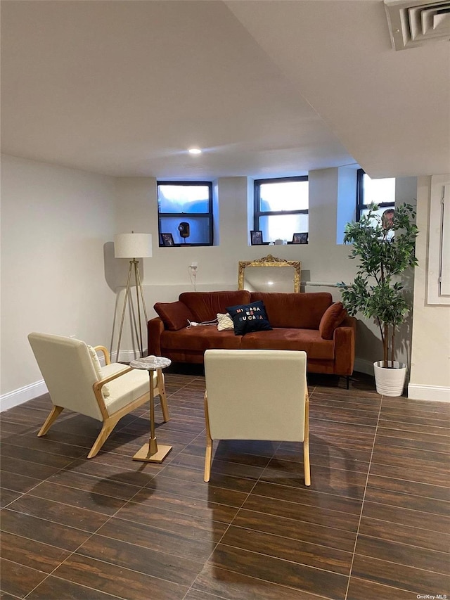 living room featuring dark tile patterned flooring