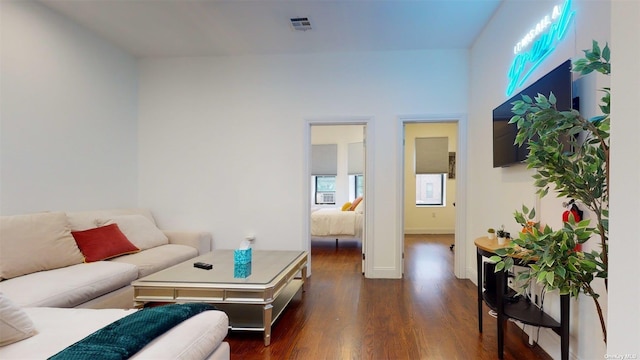 living room featuring dark hardwood / wood-style flooring