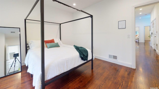 bedroom featuring dark hardwood / wood-style floors