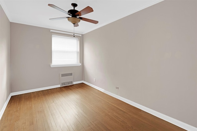 162-21 Powells Cove Blvd Unit 3D, Beechhurst, NY 11357 - spare room featuring hardwood / wood-style floors, crown molding, radiator heating unit, and ceiling fan