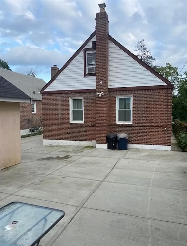 back of property with a patio