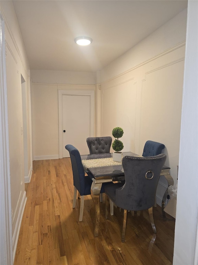 dining area with light hardwood / wood-style flooring