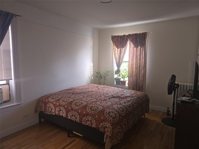 bedroom featuring hardwood / wood-style flooring