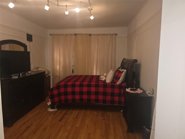 bedroom with wood-type flooring