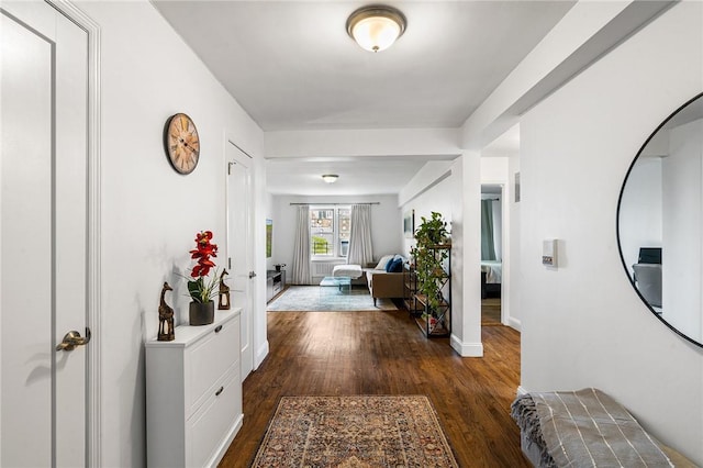 hallway with dark wood-type flooring