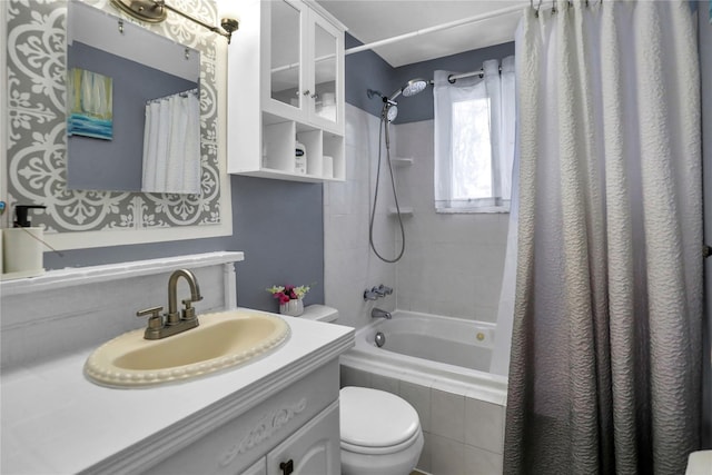 full bathroom with vanity, toilet, and shower / bath combination with curtain