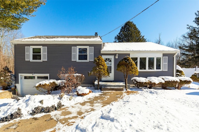 view of front of property with a garage