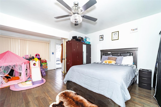 bedroom with dark wood-type flooring and ceiling fan