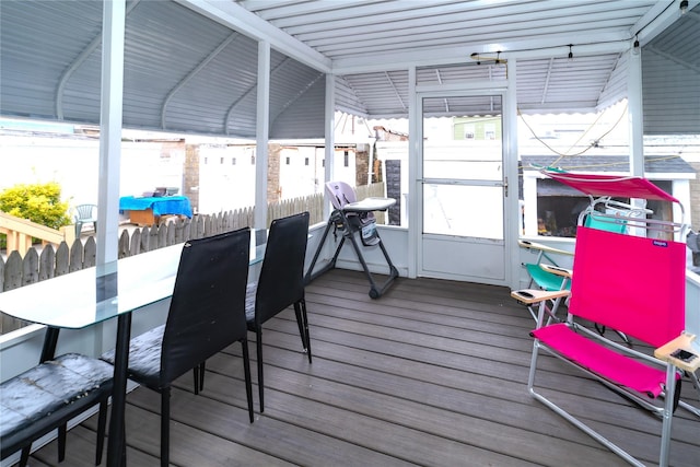 sunroom / solarium with vaulted ceiling