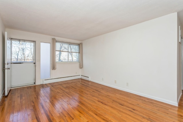 entryway featuring a baseboard radiator and light wood-type flooring