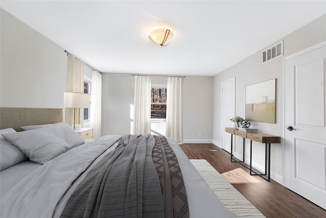 bedroom featuring dark wood-type flooring