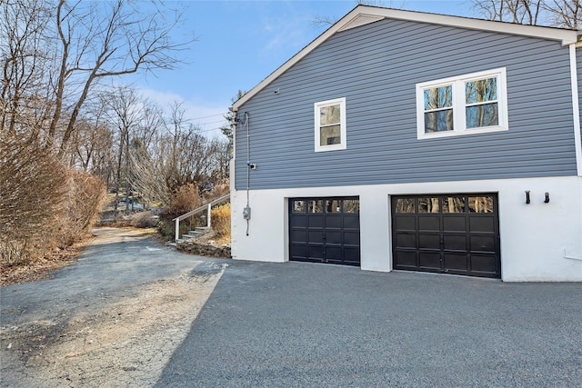 view of side of property with a garage