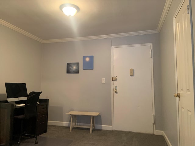 home office with ornamental molding and dark colored carpet