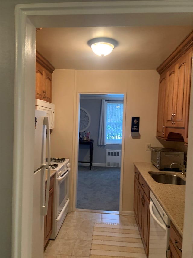 kitchen with sink and white appliances