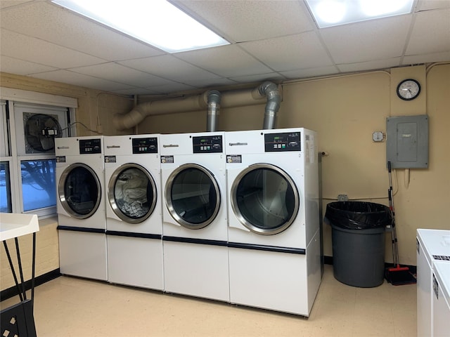 washroom featuring electric panel and washer and dryer