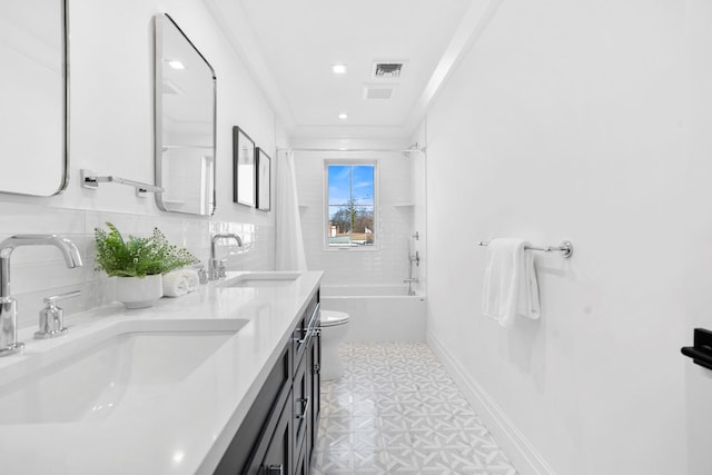 full bathroom featuring toilet, crown molding, shower / bath combination, vanity, and backsplash