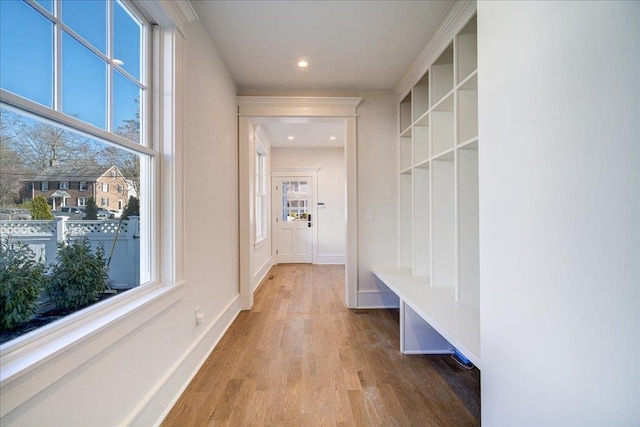 mudroom featuring light wood-type flooring, baseboards, and recessed lighting