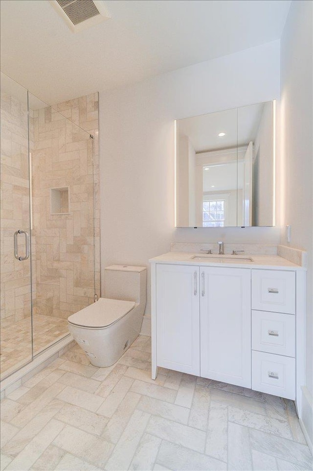 bathroom featuring toilet, a shower stall, visible vents, and vanity