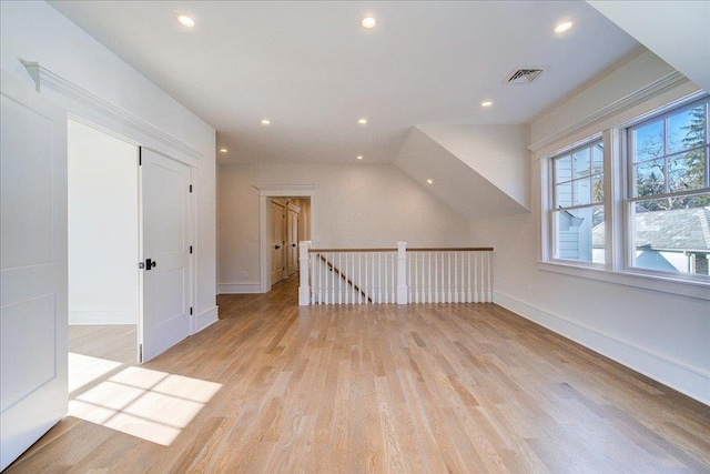 bonus room featuring recessed lighting, light wood-style flooring, and baseboards