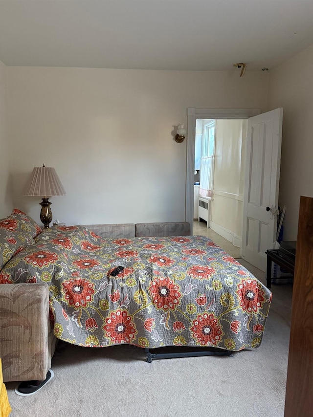 carpeted bedroom featuring radiator heating unit