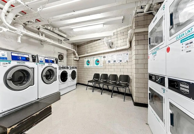 washroom featuring stacked washer and clothes dryer and separate washer and dryer