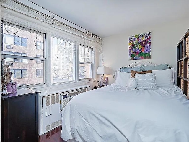 bedroom featuring dark hardwood / wood-style flooring