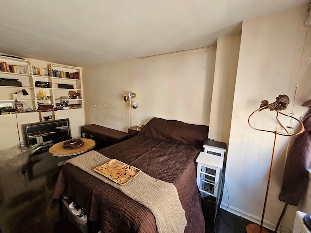bedroom with wood finished floors