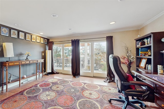 office area featuring ornamental molding and light hardwood / wood-style flooring