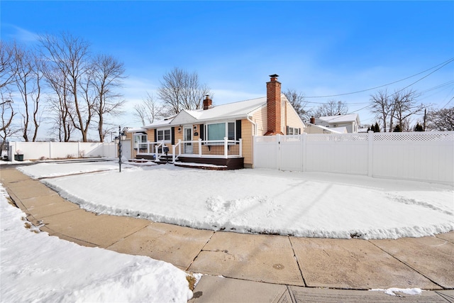 view of snow covered house