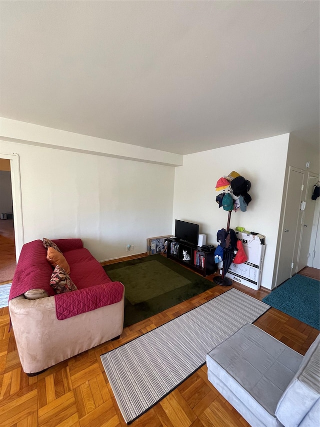 living room featuring parquet floors