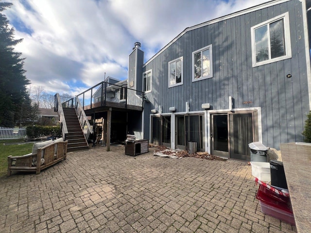 rear view of property featuring a patio