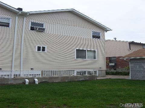 view of home's exterior with a lawn