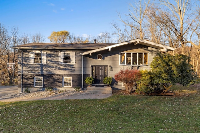 bi-level home with a front yard