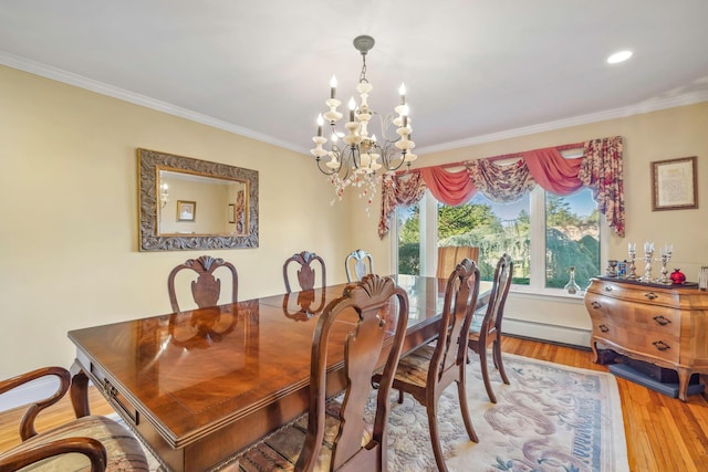 dining room featuring wood-type flooring, a baseboard radiator, an inviting chandelier, and ornamental molding