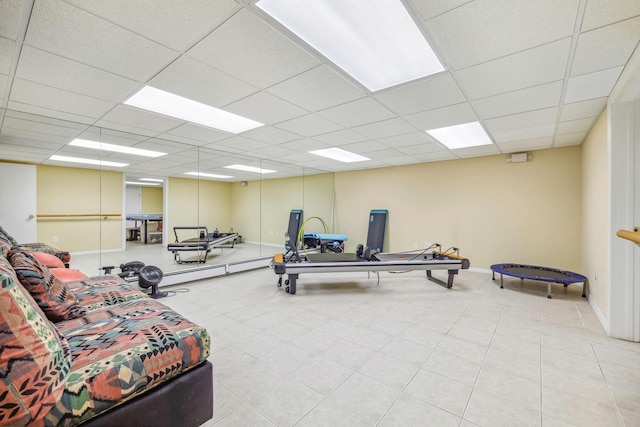 workout room with a drop ceiling